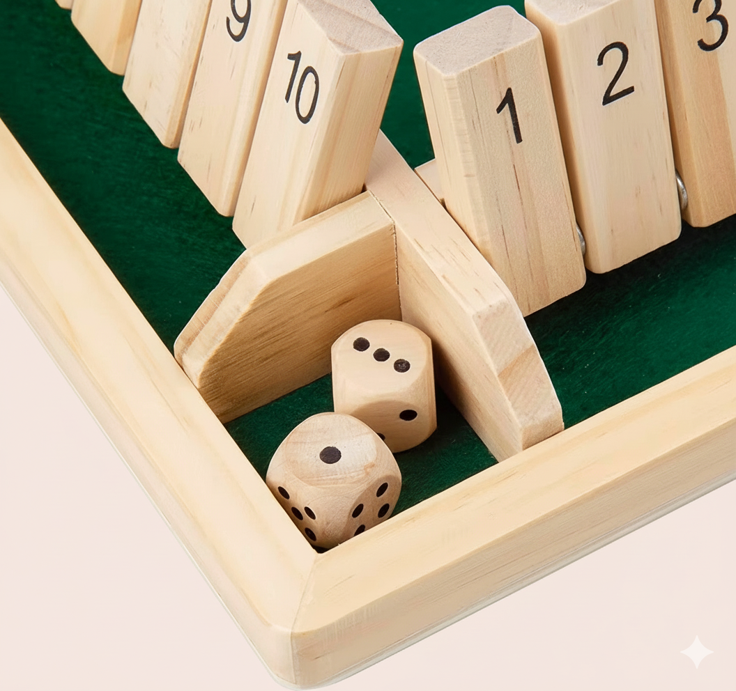 Wooden dice game with numbered wooden blocks and dice on a green surface