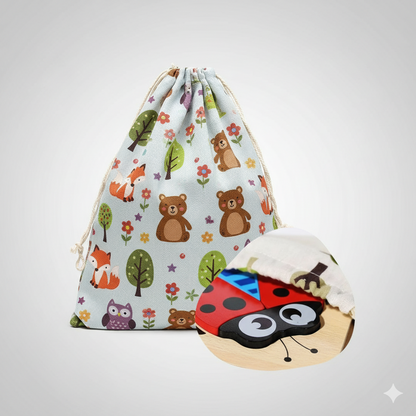 Drawstring bag with animal pattern and wooden ladybug puzzle on a light gray background
