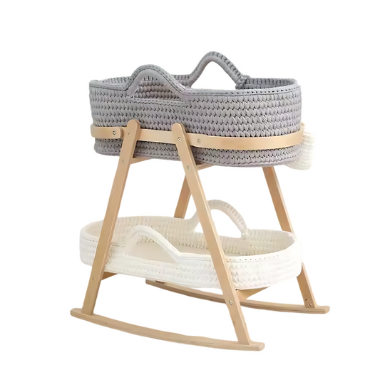 Gray woven baby bassinet with wooden stand on a white background
